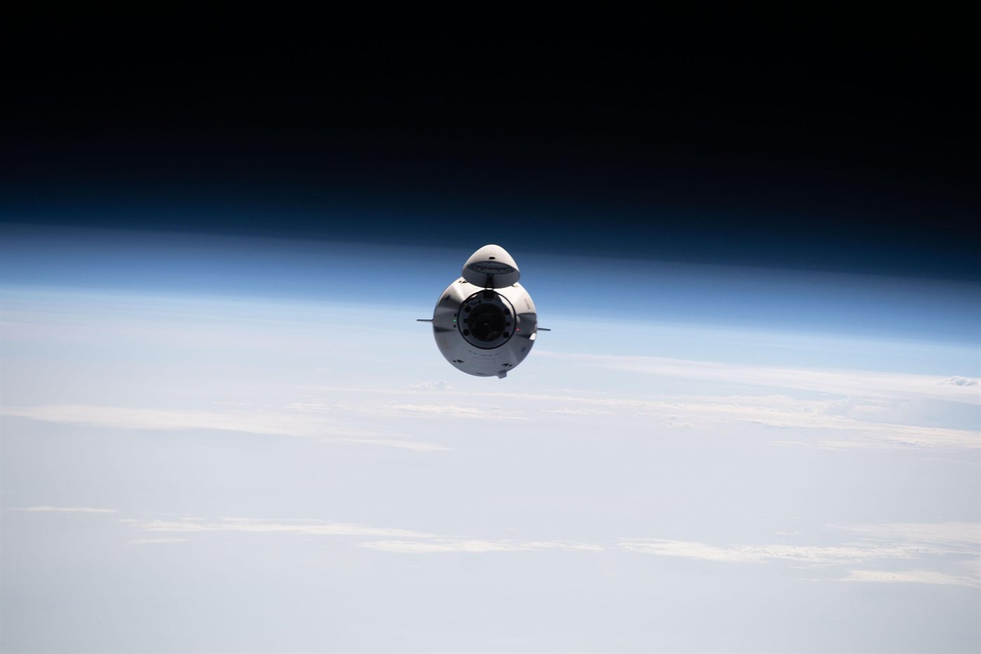 Dragon in free flight above Earth